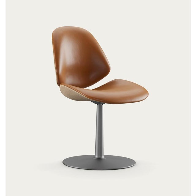 Salto and sigsgaard council family salon chair base: graphite, duo upholstery: front: nevada cognac + back: remix 242 for...