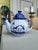 Vintage blue and white ceramic teapot with a nautical theme. It features a distinctive blue and white color scheme with a...
