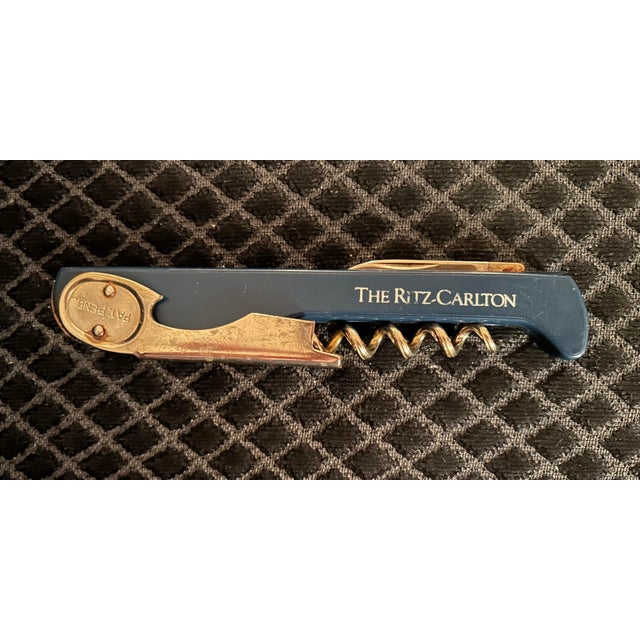 Vintage blue Ritz Carlton wine opener, bottle opener. Stamped made in Italy. Double-Hinged Fulcrum: Provides two steps of...