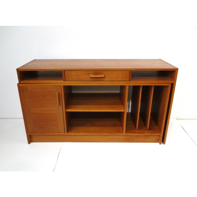 A teak expandable 2-piece stereo record and desk cabinet with an area for your equipment, one door with storage and...