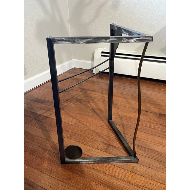 A striking 1980s Postmodern geometric side table featuring exceptional architectural lines and premium materials. This...