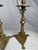 A striking pair of antique, late 19th-century heavy cast brass candlesticks, beautifully modeled in the early Spanish...
