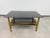 An elegant and highly sophisticated postmodern two-tier coffee table, manufactured in Italy during the 1980s. Designed in...
