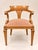 A set of twelve empire/neoclassical style armchairs in solid oak, displaying a golden honey patina from age. the curved,...