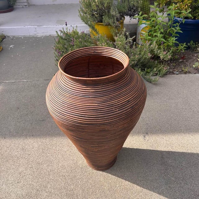 Striking vintage floor vase handcrafted from tightly wrapped pencil reed rattan in a sculptural amphora silhouette after...
