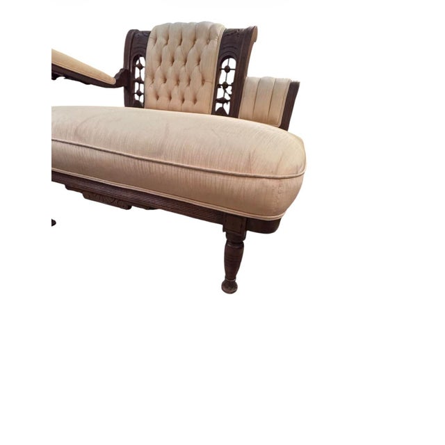 An elegant late 19th-century American Victorian settee, crafted in richly toned walnut and dating to approximately...