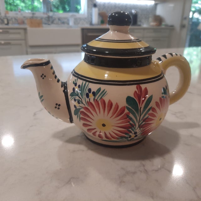 Quimper Tea set for two with vibrant colors dating back to the 1980's. The pattern is an Ivoire Corbeille rendition. It...
