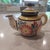 Quimper Tea set for two with vibrant colors dating back to the 1980's. The pattern is an Ivoire Corbeille rendition. It...