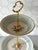 Elevate your tea parties and special gatherings with this elegant two-tier porcelain serving stand. Featuring vintage...
