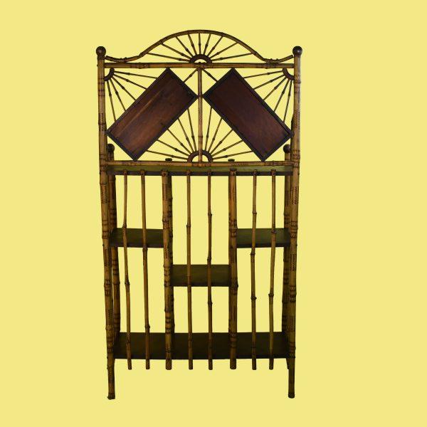 A tall burnt-bamboo British Colonial mirrored shelf with a sunburst crest and twin diamond mirrors. Multiple open shelves...