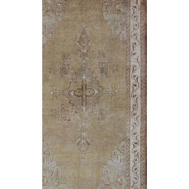 Measures: 6'9 x 12'0. Vintage Turkish Kars Rug with Light Tan Field and Soft Ivory Border 6'9 x 12'0. Keivan Woven Arts /...