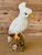 Charming mid-20th century Italian Majolica ceramic figurine of a white cockatoo perched on a colorful floral tree stump....