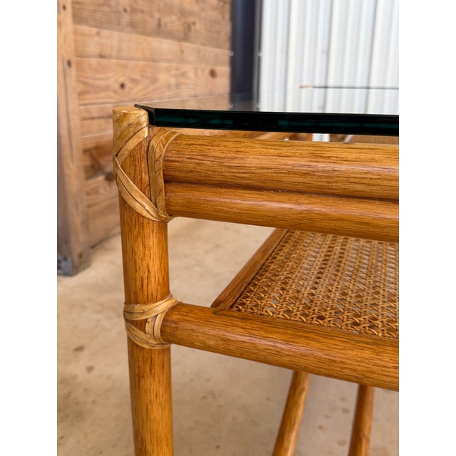 Pair of Vintage McGuire Organic Modern Rattan Side Tables With Cane Shelves and Glass Tops For Sale - Image 11 of 12