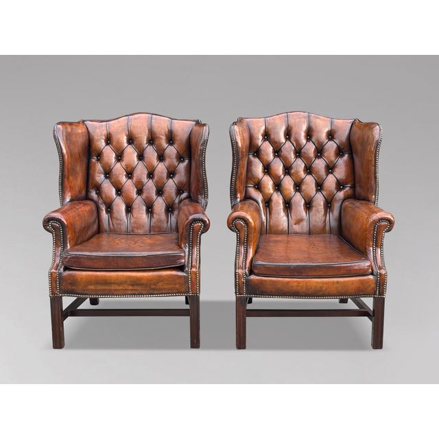 Quality Pair of late 19th-Century Brown Leather Chesterfield Wing Armchairs A fine quality pair of late 19th-century...