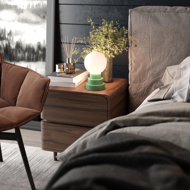 GLOBE - where artistic design meets portable sophistication. This enchanting table lamp pairs a pristine white glass orb...