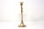 A vintage, brass candle holder, in the form of a horn or trumpet. Good condition; natural patina.