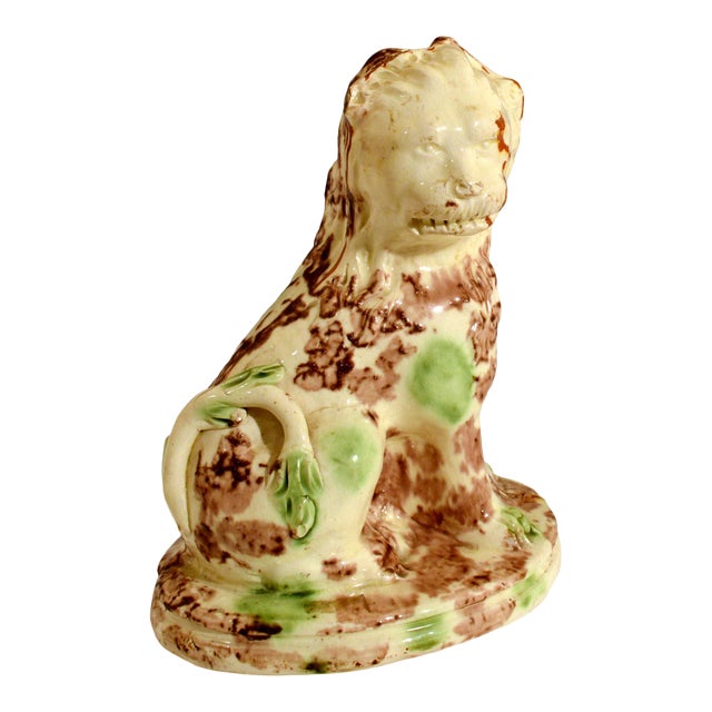 English Creamware Pottery Model of a Seated Lion, With a Whieldon-Type Tortoise-Shell Glaze, Circa 1765-85 For Sale
