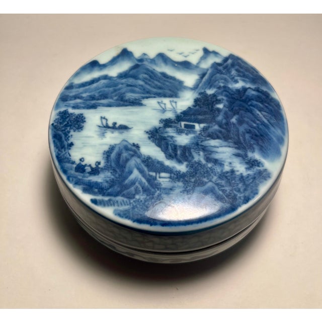 Offered is a beautiful circa 1930s Chinese Republic Period hand-painted blue and white porcelain powder box featuring...