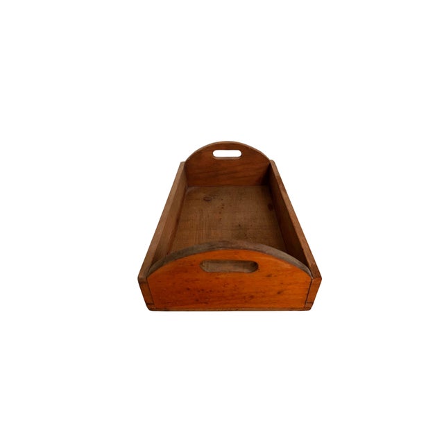 A beautiful decorative and functional antique wood carrying tray. Circa Mid 20th Century.