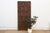 This antique Yoruba door from Nigeria is carved across a single wide plank, divided into four stacked narrative registers,...