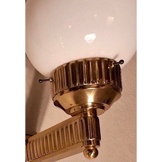 Astoria' wall light in brass with opal glass globes. The original design was by Josef Hoffmann for the Grand Hotel Astoria...