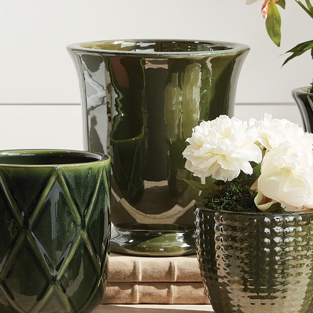 This set of earthenware pots are designed for the outdoors, but are equally as beautiful indoors. From the depth of the...