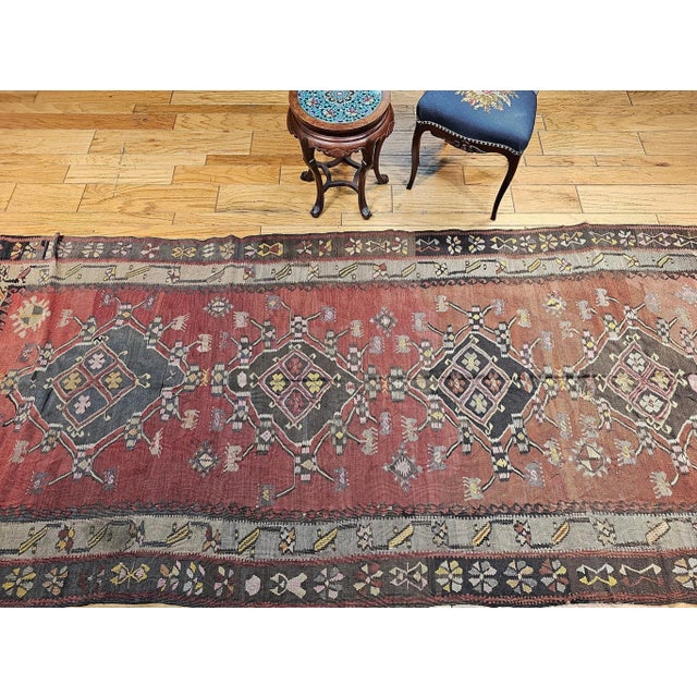 5’ x 11’ 3” Beautiful vintage Turkish kilim from Eastern Turkey in a multiple medallion pattern from the early 1900s. This...