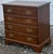 Classic solid cherry bachelors chest circa late 20th century. Features four dovetailed drawers, bracket feet, solid brass...