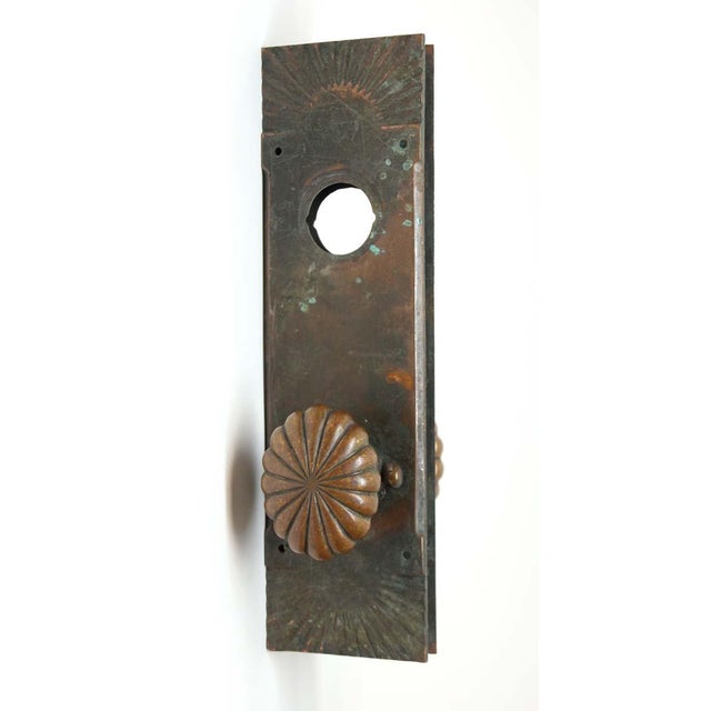 Bronze fluted oval door knob set with cylinder lock insert back plates. The set includes two knobs with a spindle and two...