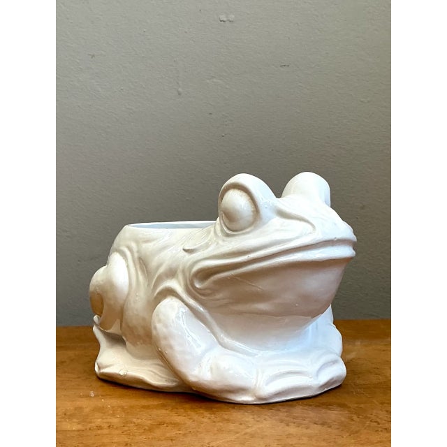 Infused with mid-century Italian charm and whimsical Hollywood Regency flair, this vintage ceramic frog vase features an...