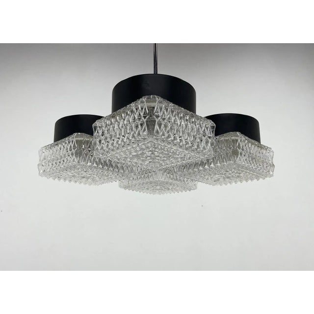 Vintage pressed glass, chrome and black metal pendant, made by Napako. Marked by the manufacturer. Bulbs: 4 x E27 or E26....