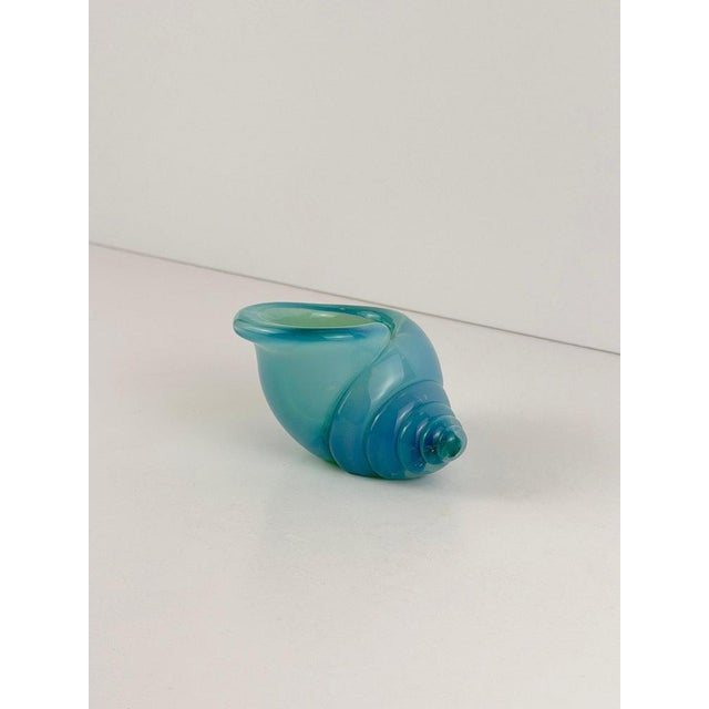 This murano alabastro glass shell by archimede seguso was made in murano, italy, during the 1960s and is formed in richly...