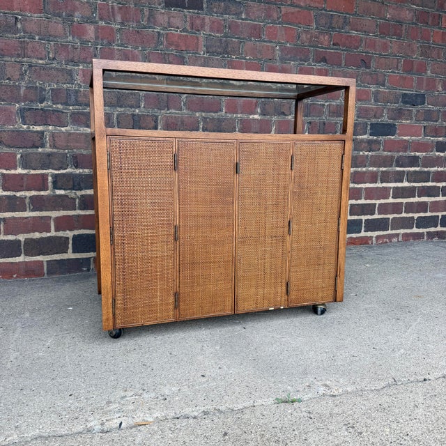 Vintage Mid-Century Modern rolling bar cart or buffet server designed by Jack Cartwright for Founders Furniture, circa...
