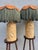 An extraordinary pair of vintage ceramic table lamps: cylindrical cream and amber bases covered in raised relief depicting...