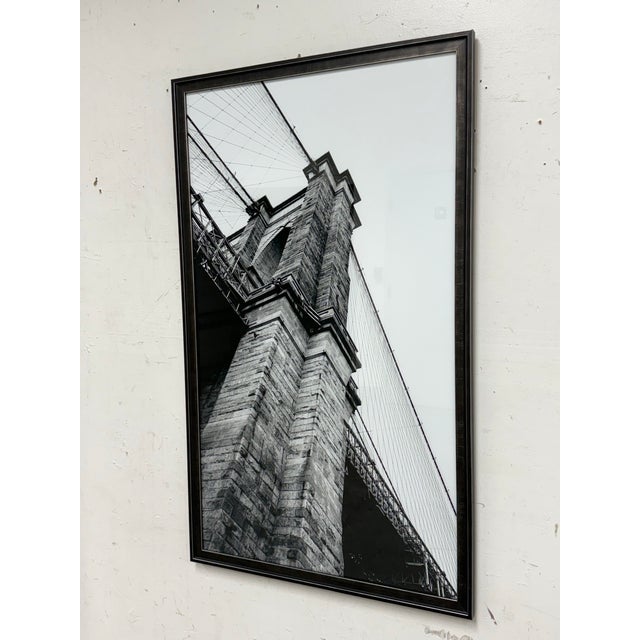 Design Plus Gallery presents Dark Side Calling by AZ Jackson. This is a photographic print that showcases the Brooklyn...