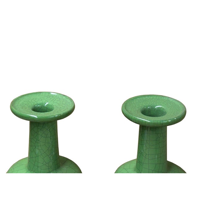 Elevate your home decor with this exquisite pair of vintage ceramic vases, each a testament to timeless craftsmanship....