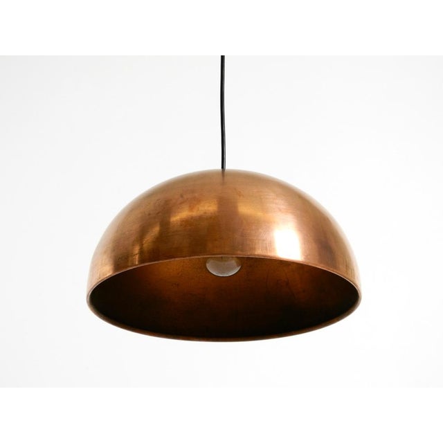Elegant, beautiful, original mid-century modern pendant lamp with a solid copper shade. Made in italy. the shade is...