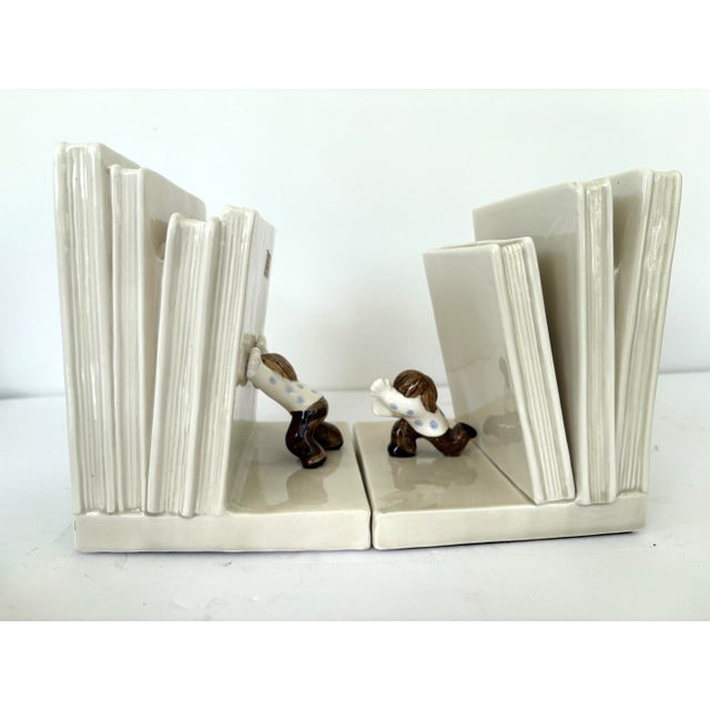 1970s 1970s Fitz & Floyd Handpainted Ceramic “Book Pushers” (“Falling Books”) Bookends Set For Sale - Image 5 of 12