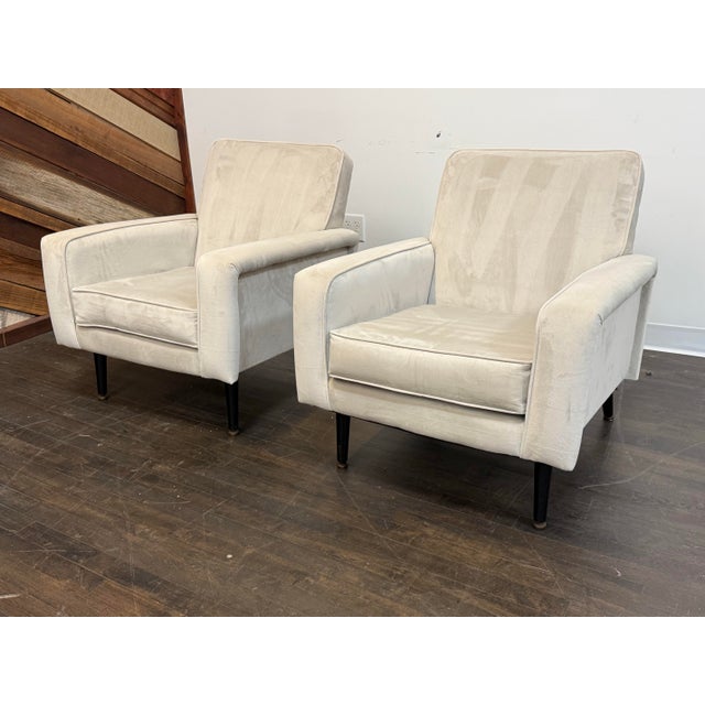 Design Plus Gallery presents a Pair of Circa 1960's Lounge Arm Chairs. A pair of French lounge armchairs, showcasing a...