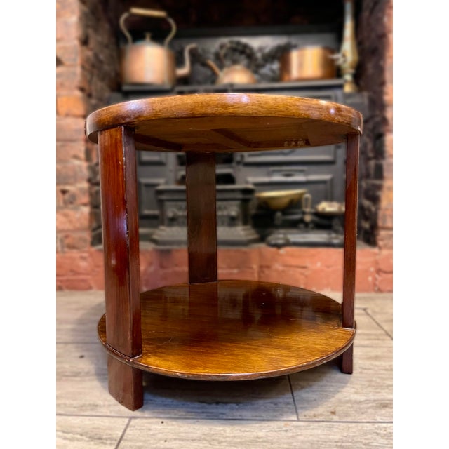 A quietly confident piece from the mid-century period, this circular coffee table combines Art Deco sensibility with the...