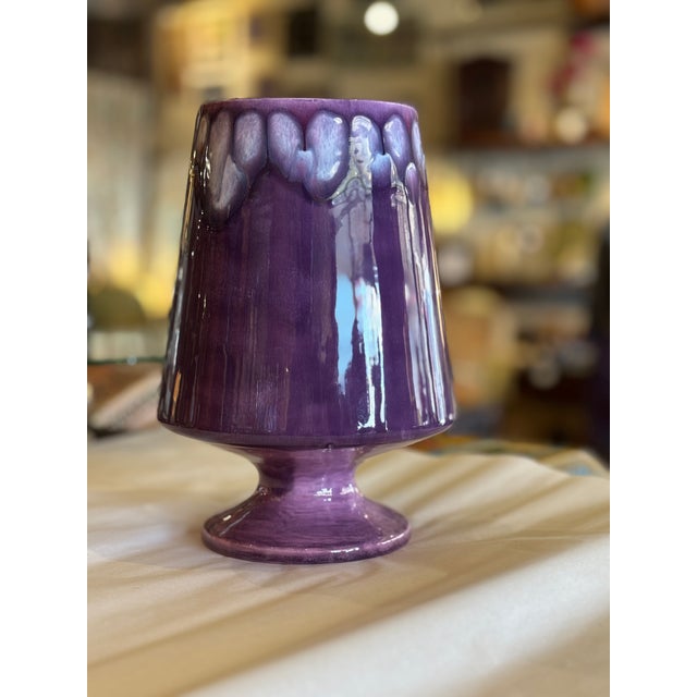Lovely mid century modern vase in a violet or purple outer glaze with drip detail at the rim and a pink interior glaze....
