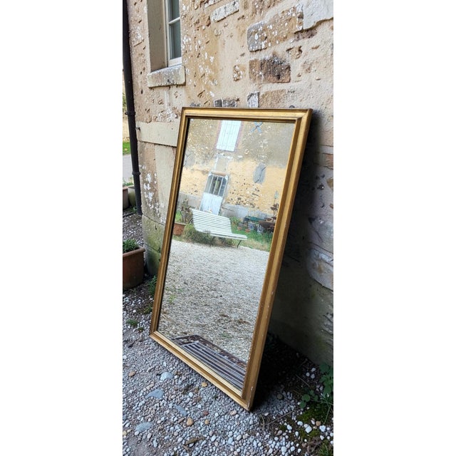 Louis Philippe style stucco and gilt wood mirror. Dimensions: 76.5 x 130 cm Depth: 2.5 cm Weight: 22 kg Hanging hardware...