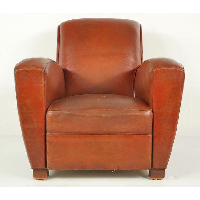 Vintage Art Deco dark brown leather studded club chairs made in France. It has a flat topped square back, cigar style...