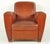 Vintage Art Deco dark brown leather studded club chairs made in France. It has a flat topped square back, cigar style...