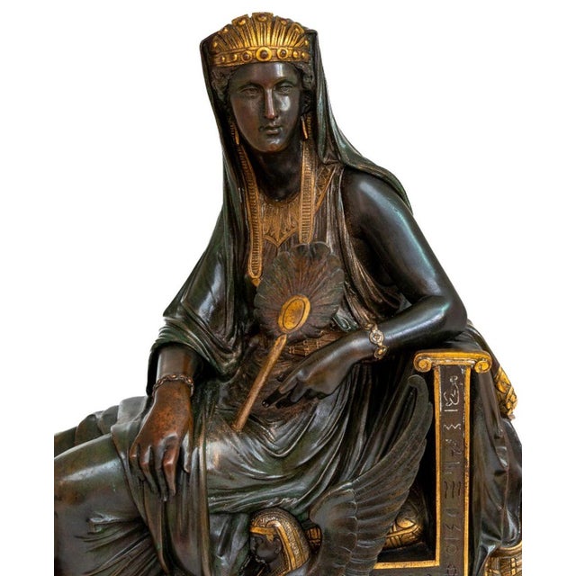 Leon Pilet (French, 1840-1916) "Cleopatra" Patinated and Gilt Bronze Sculpture, late 19th century, the seated queen...