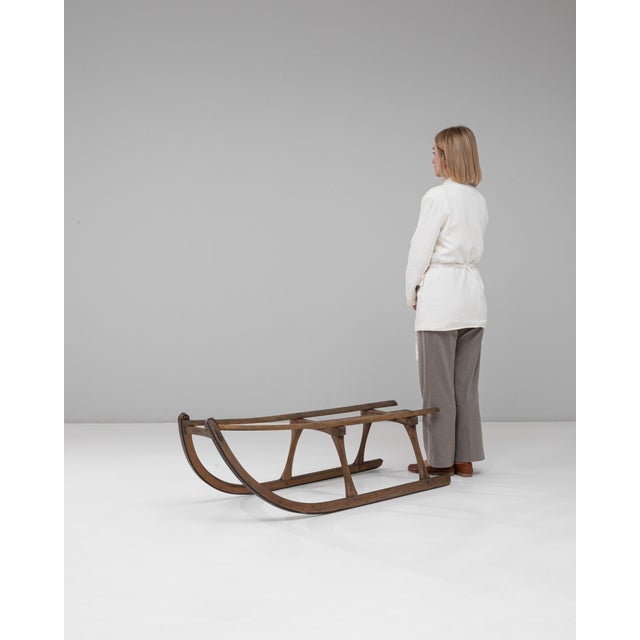 This 1900s Czech bentwood sled is a fine example of early European craftsmanship, showcasing the distinctive curved forms...