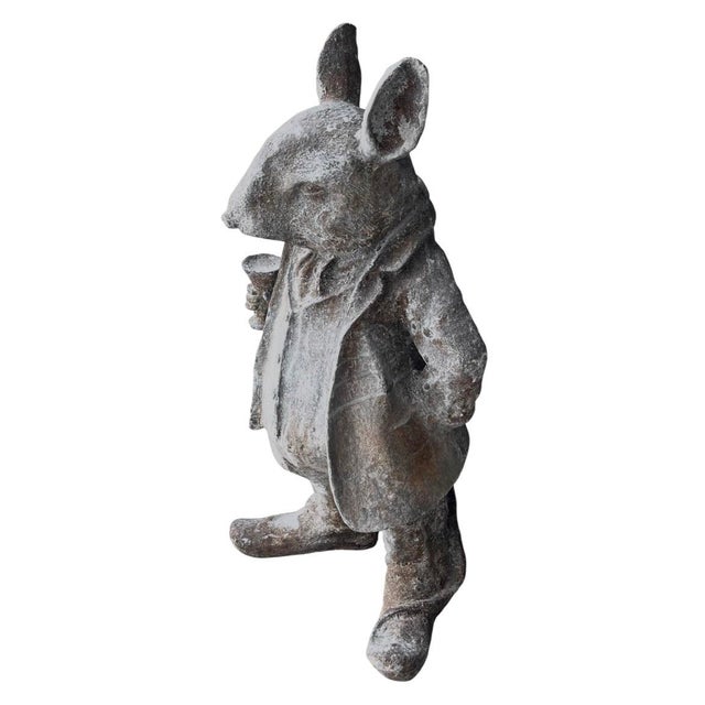 An exceptional and highly charming vintage anthropomorphic cast iron garden statue depicting a refined gentleman mouse...