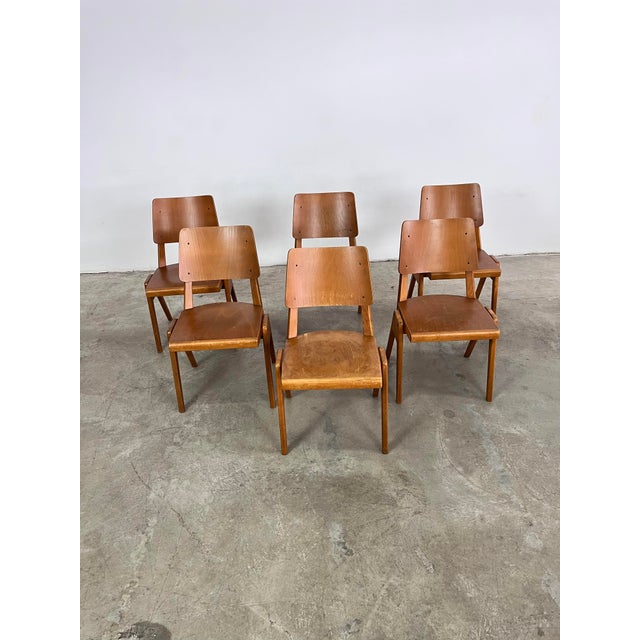 Dimensions: H 31.5” x W 18.5” x SD 16.7” x SH 17.7” Set of 6 Mid-Century Modern Casala stackable bistro dining chairs....