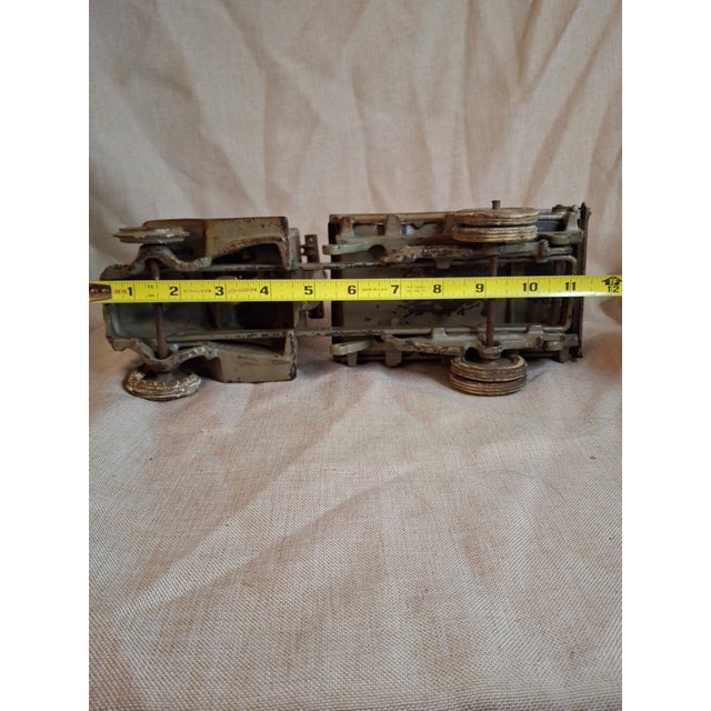 Offering a rare, large-scale Arcade Manufacturing Co. Mack AC "Bulldog" Dump Truck. This is the highly sought-after chain-...