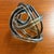 An intriguing vintage art glass sculpture featuring an elegant open knot form crafted from a continuous ribbed glass...